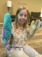 A Hope House Resident with Oven Mitts